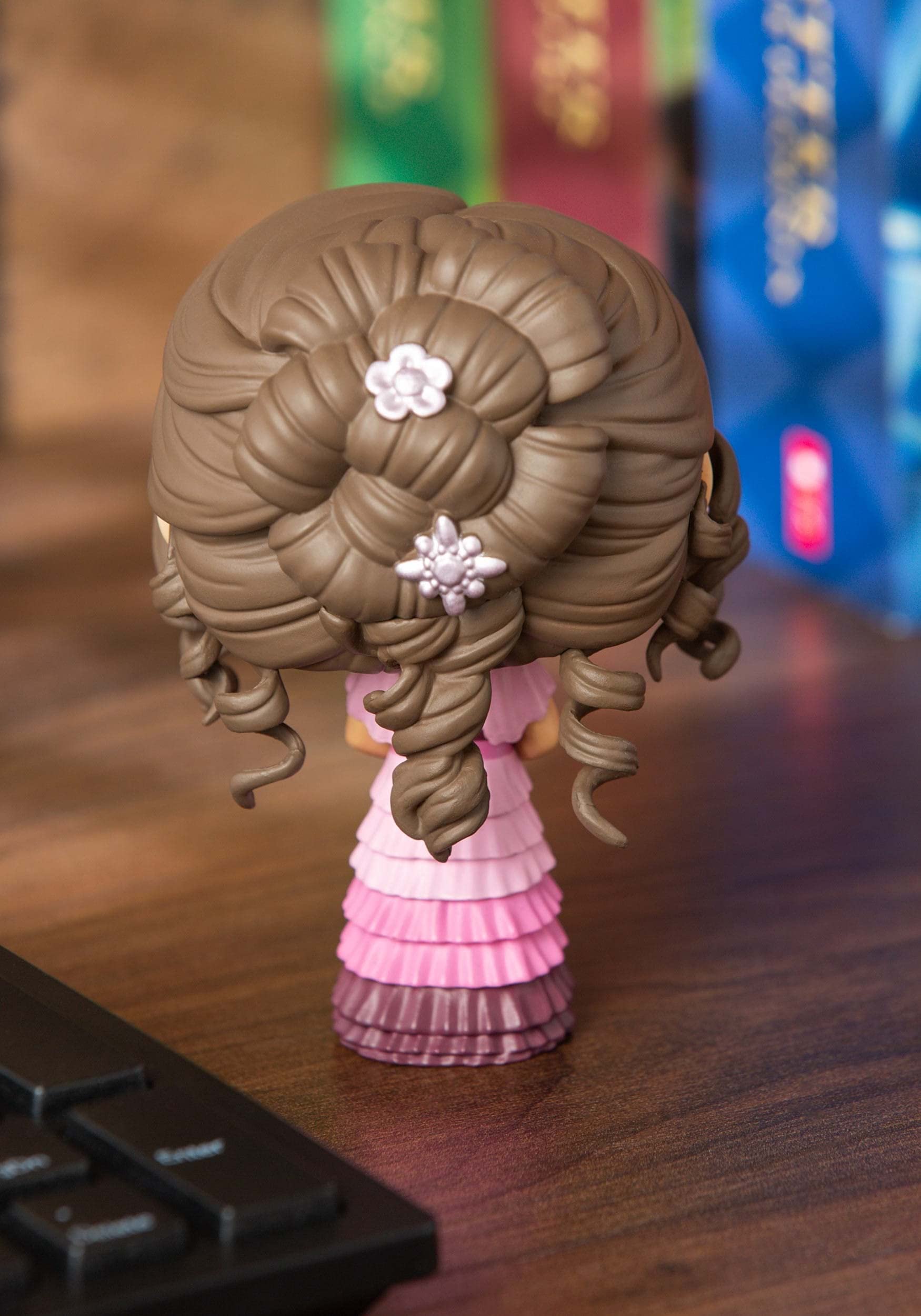 Close-up of Funko Dumbledore Pop figure side view highlighting features.