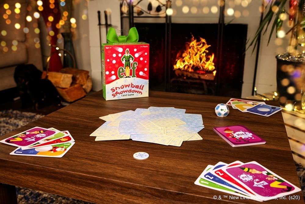 Funko Elf Snowball Showdown Card Game play scene, players enjoy a lively game night together