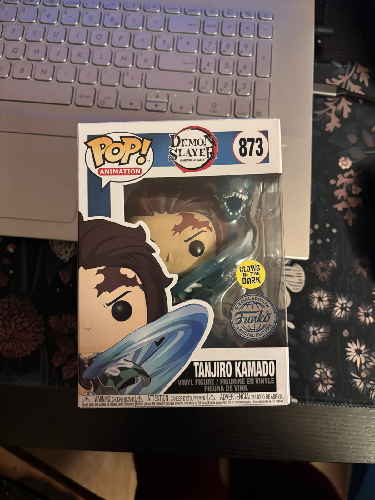 Funko POP Demon Slayer Tanjiro with Dragon glow-in-the-dark detail for night shelf display.