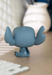 Funko Pop Disney Lilo & Stitch seated figure adds charm to a collectible display.