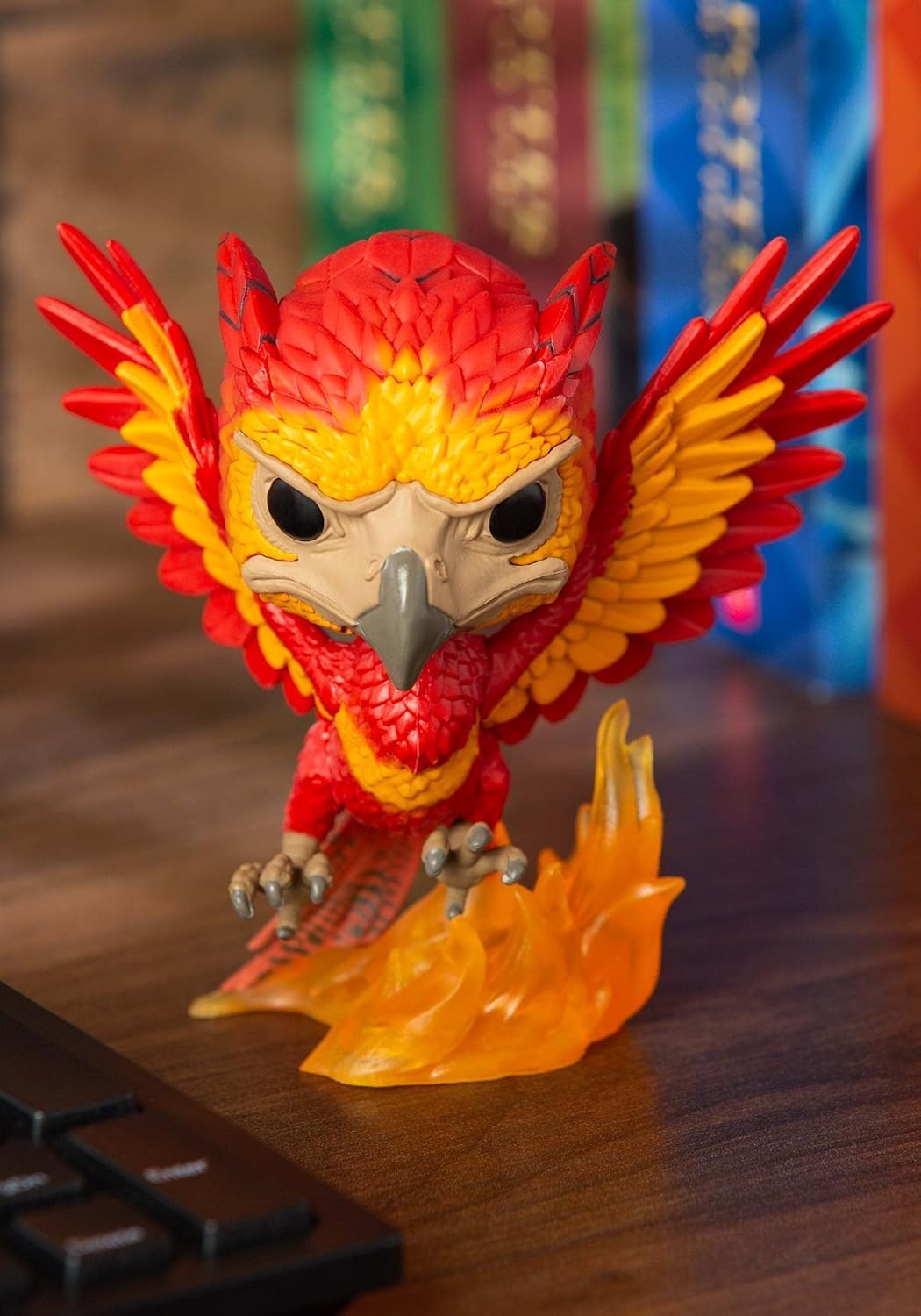 Funko Pop! Harry Potter Fawkes figure on a desk for easy display.