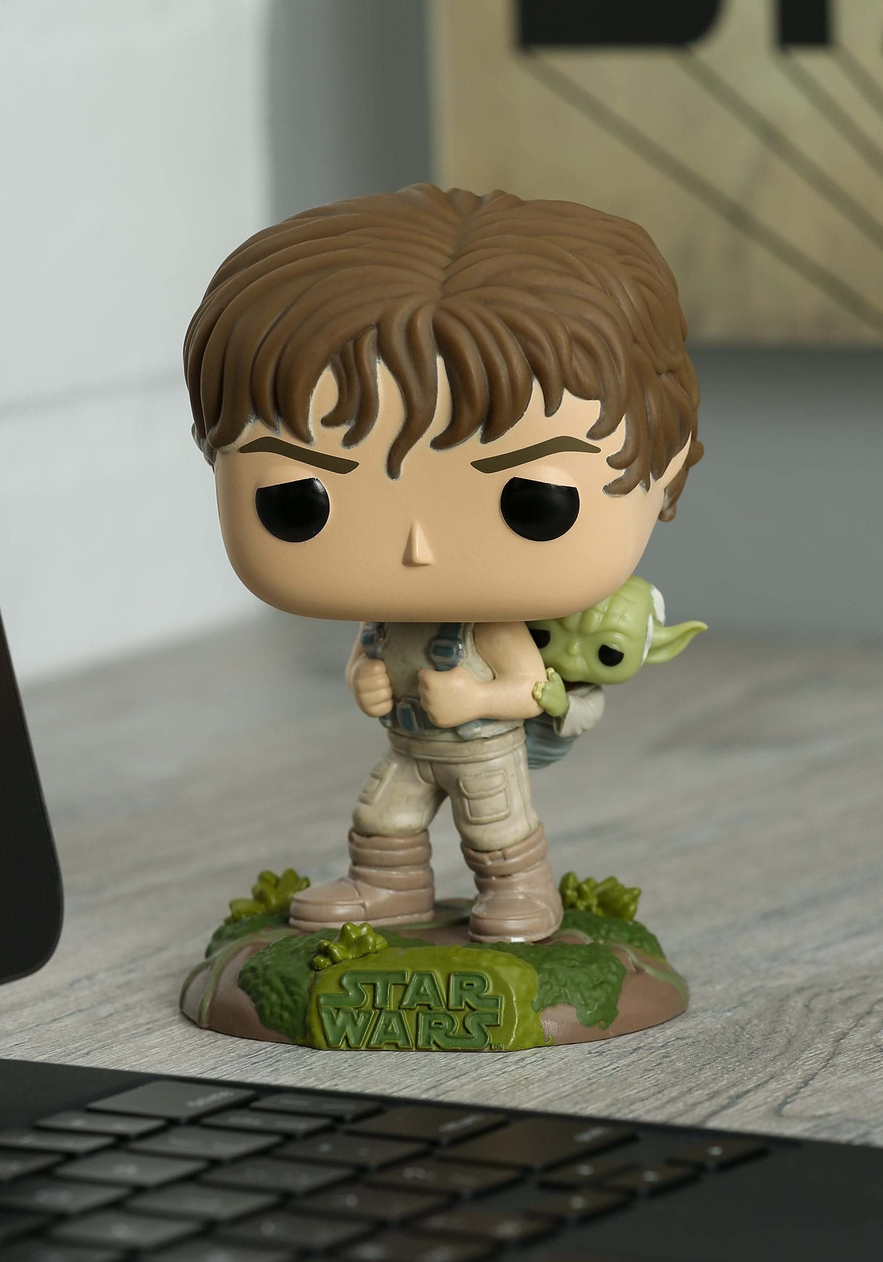 Funko Star Wars Training Luke with Yoda figure closeup for detailed features.