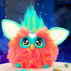 Furby Coral hair grooming with a comb for playful care.