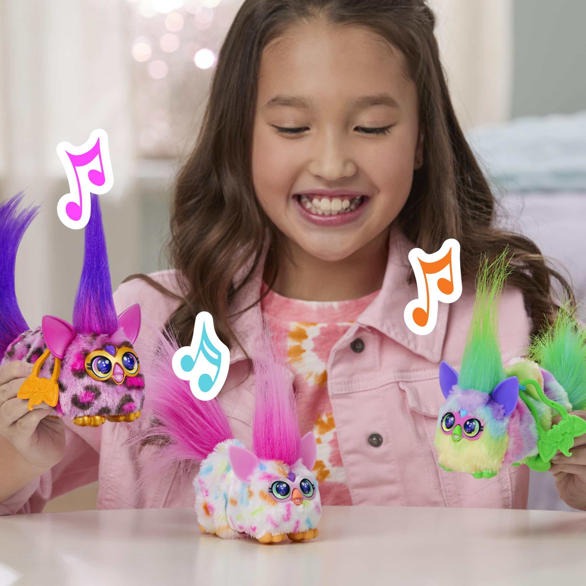 Furby DJ Furblets Kitt-Ee-Luv clip attaches to a bag for portable fun.