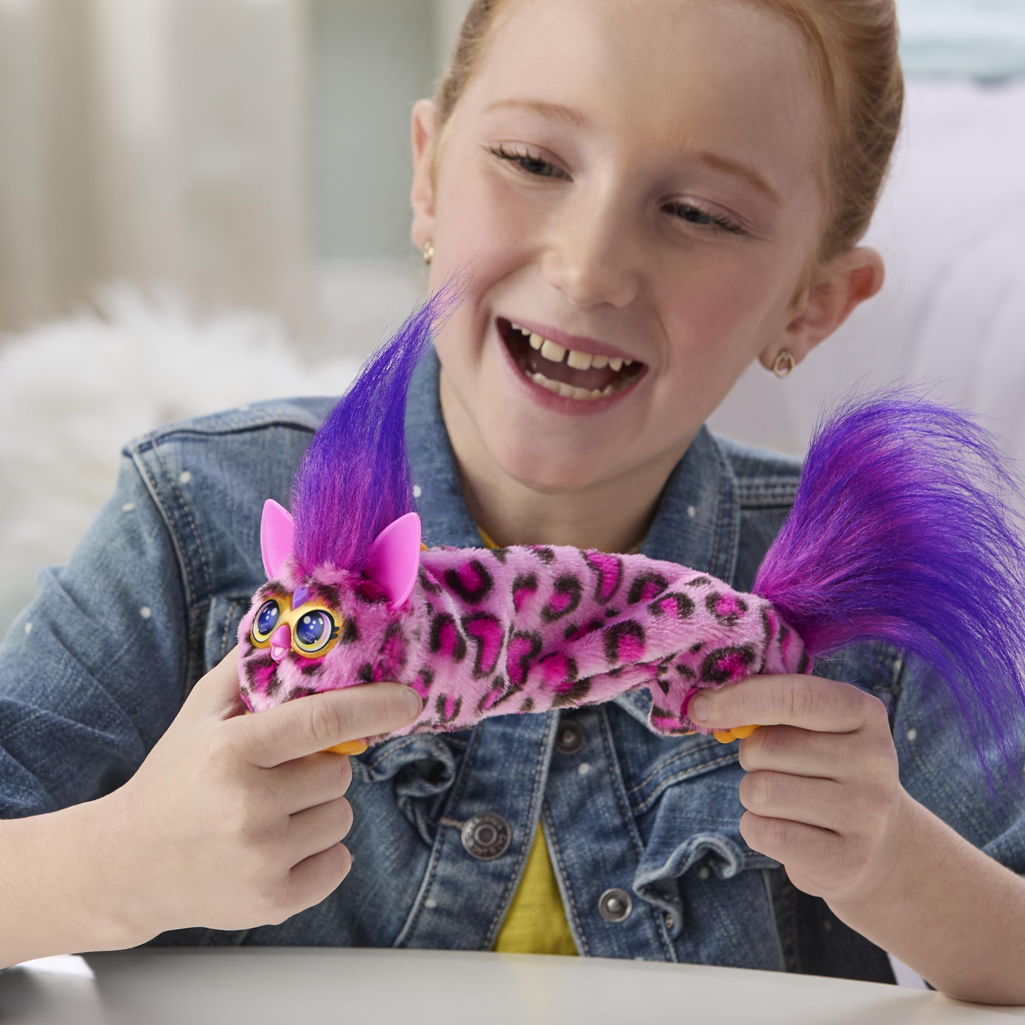 Furby DJ Furblets Kitt-Ee-Luv plays music when touched.