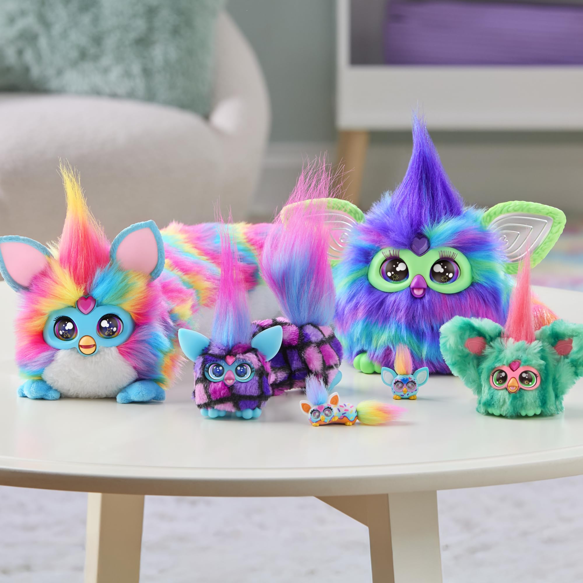 Furby DJ Furblets Rainbow-Kat mini-plush display showcasing compact size for pockets