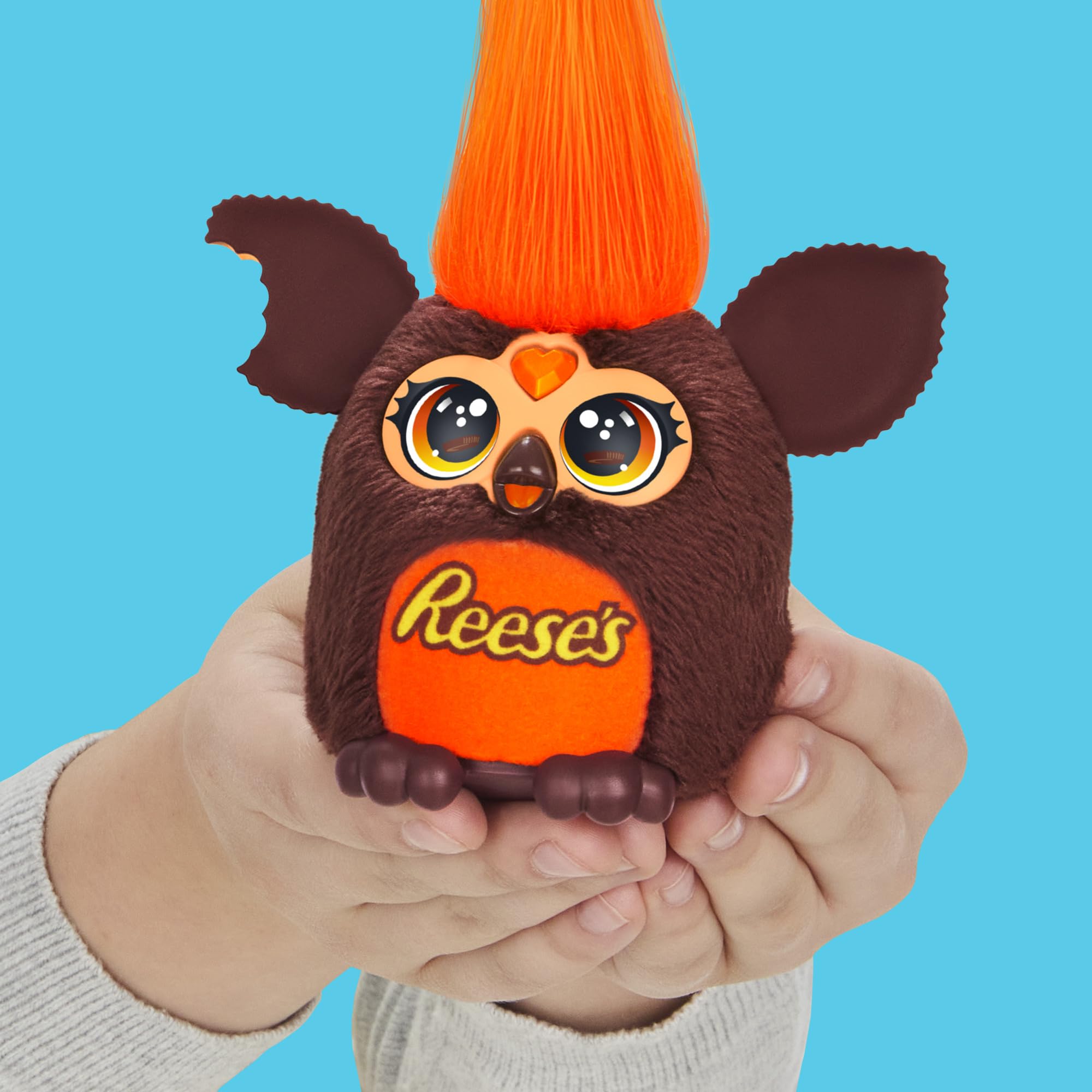 Close look at Furby Furblets Reese's cup display in a pretend cup.