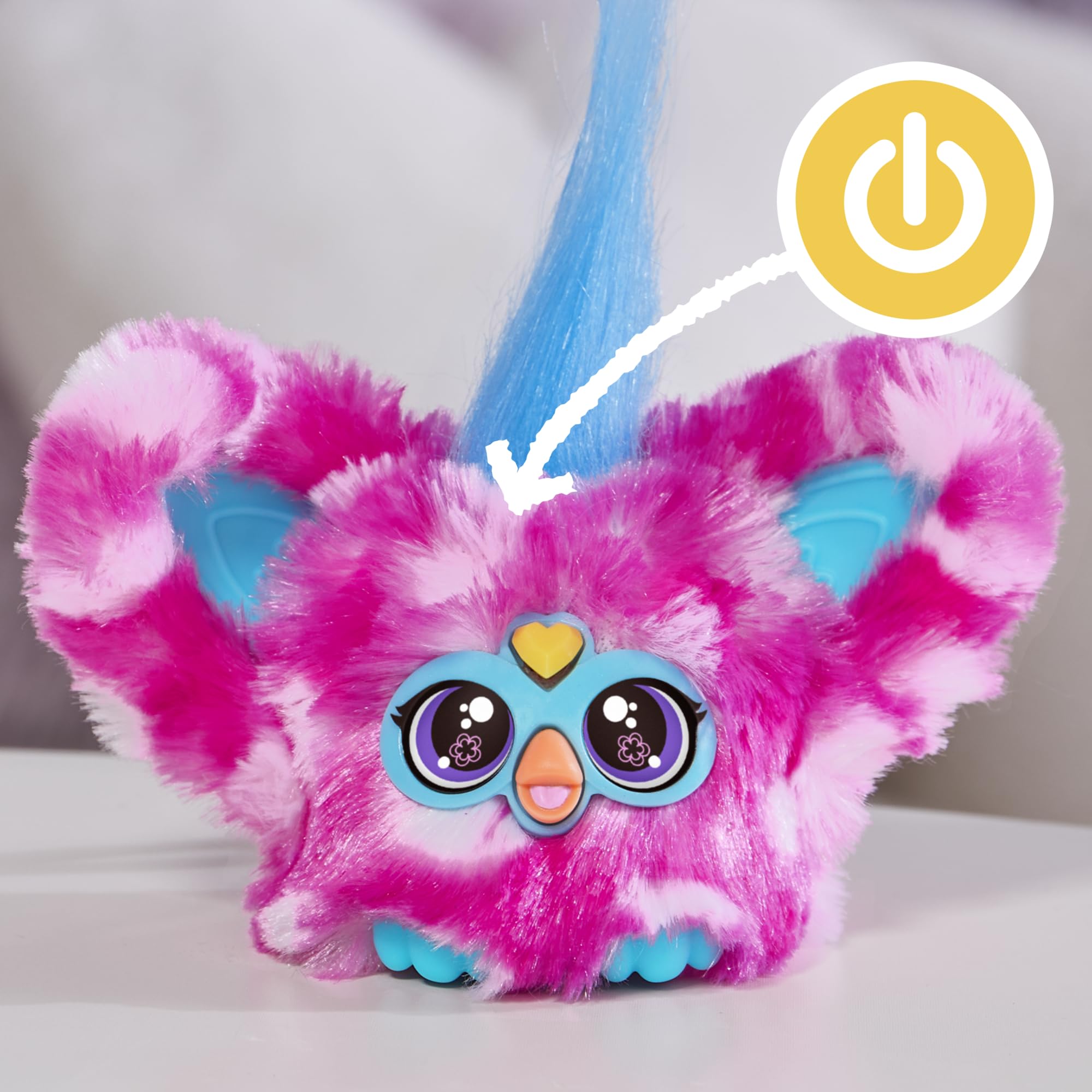 Furby Dah-Tee's peekaboo ears reveal the character for added delight.