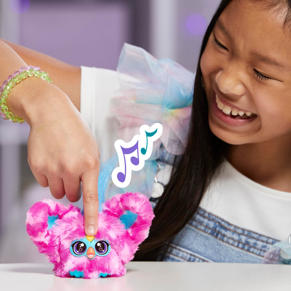 Furby Dah-Tee pairs with larger Furby sets to expand pretend-play options.
