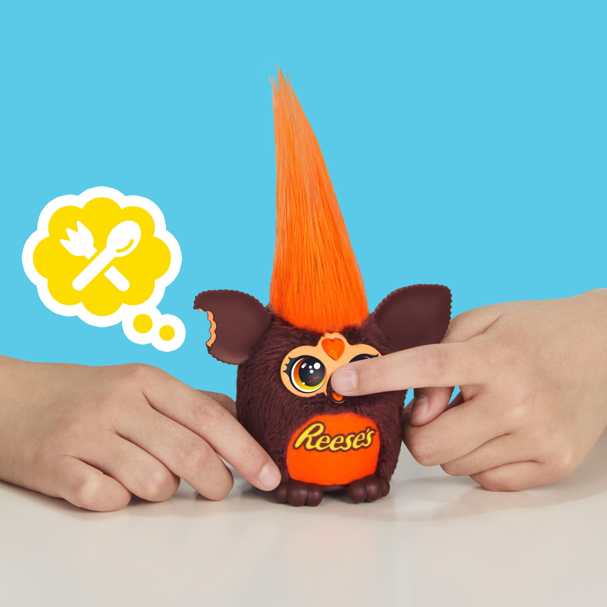 Mini plush resting in its pretend Reese's cup toy for display.
