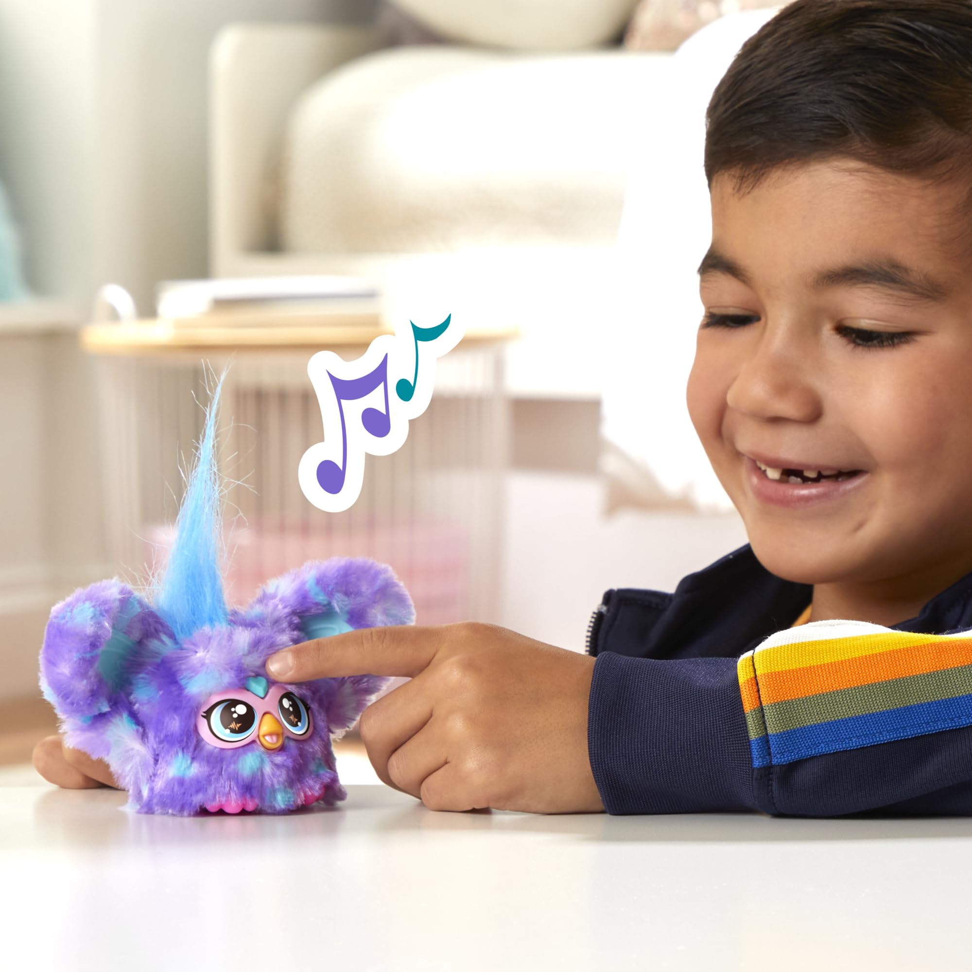 Removable keychain clip keeps Furby Groo-Vee within reach.