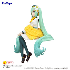 FuRyu Hatsune Miku desk-display friendly pose with flowers.