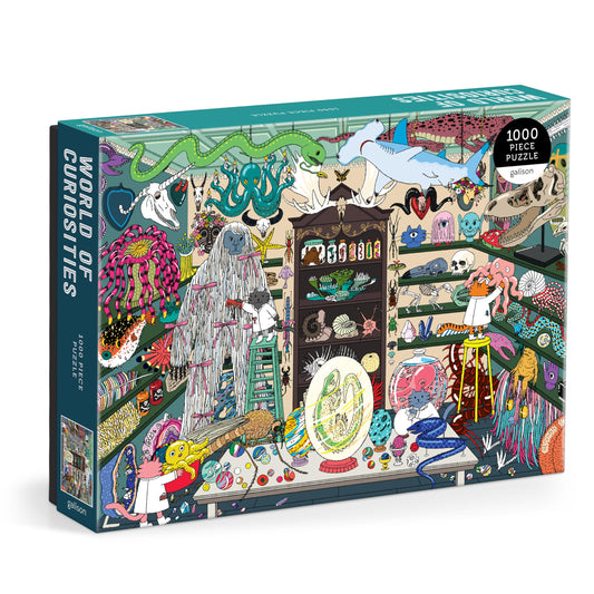 Galison World of Curiosities puzzle box and pieces ready for family puzzling fun.