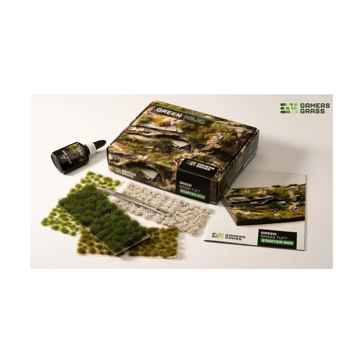 Gamers Grass Tuft Starter Box close-up showing vibrant green tufts for realistic dioramas.