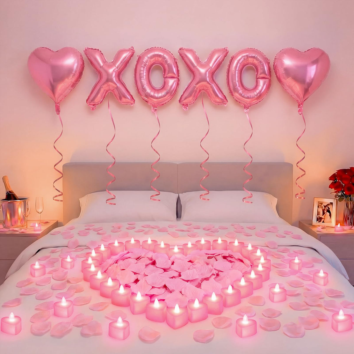 Ganeen pink XOXO letters balloons create a playful romantic centerpiece.