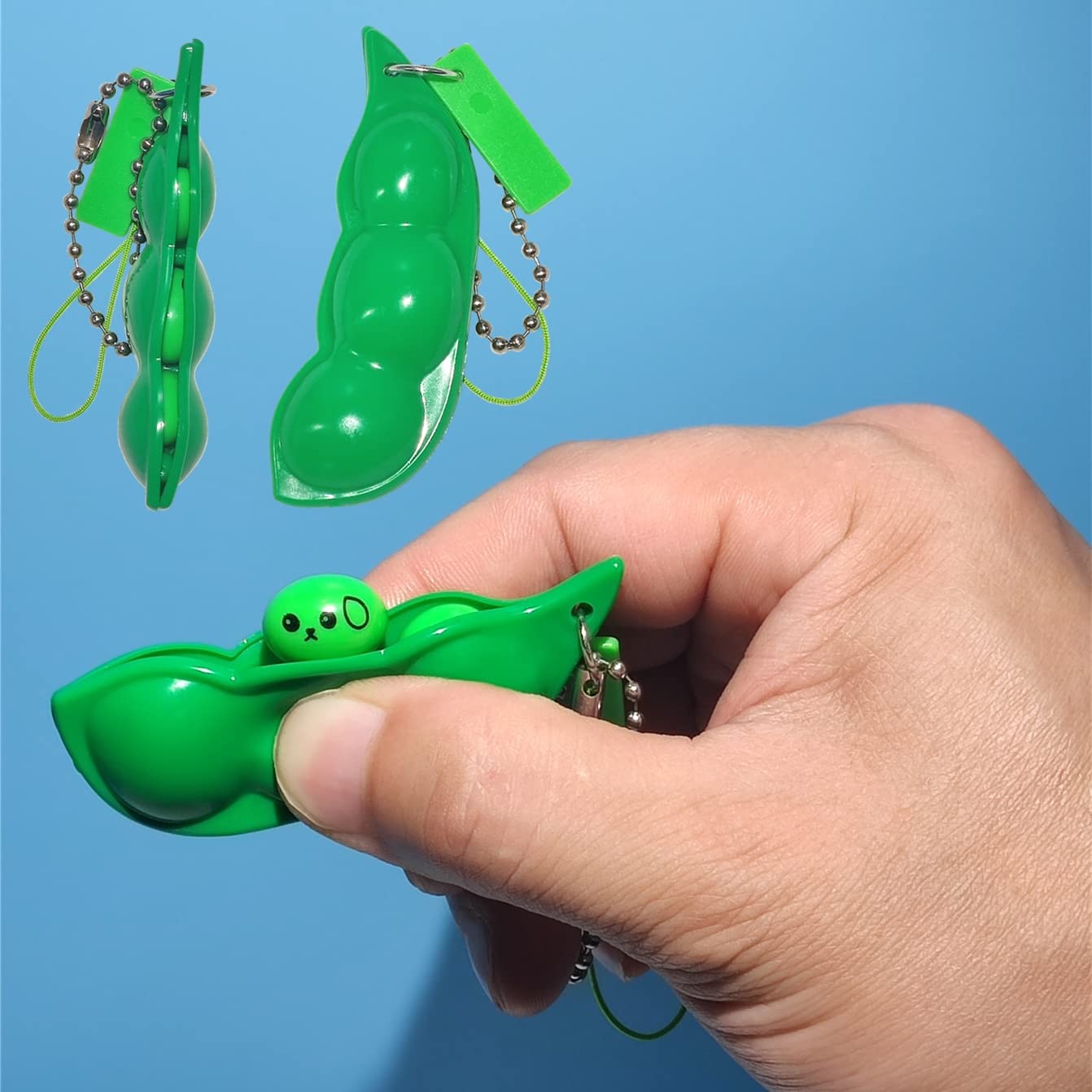 Ganjiang pea keychain on backpack, portable stress-relief companion.