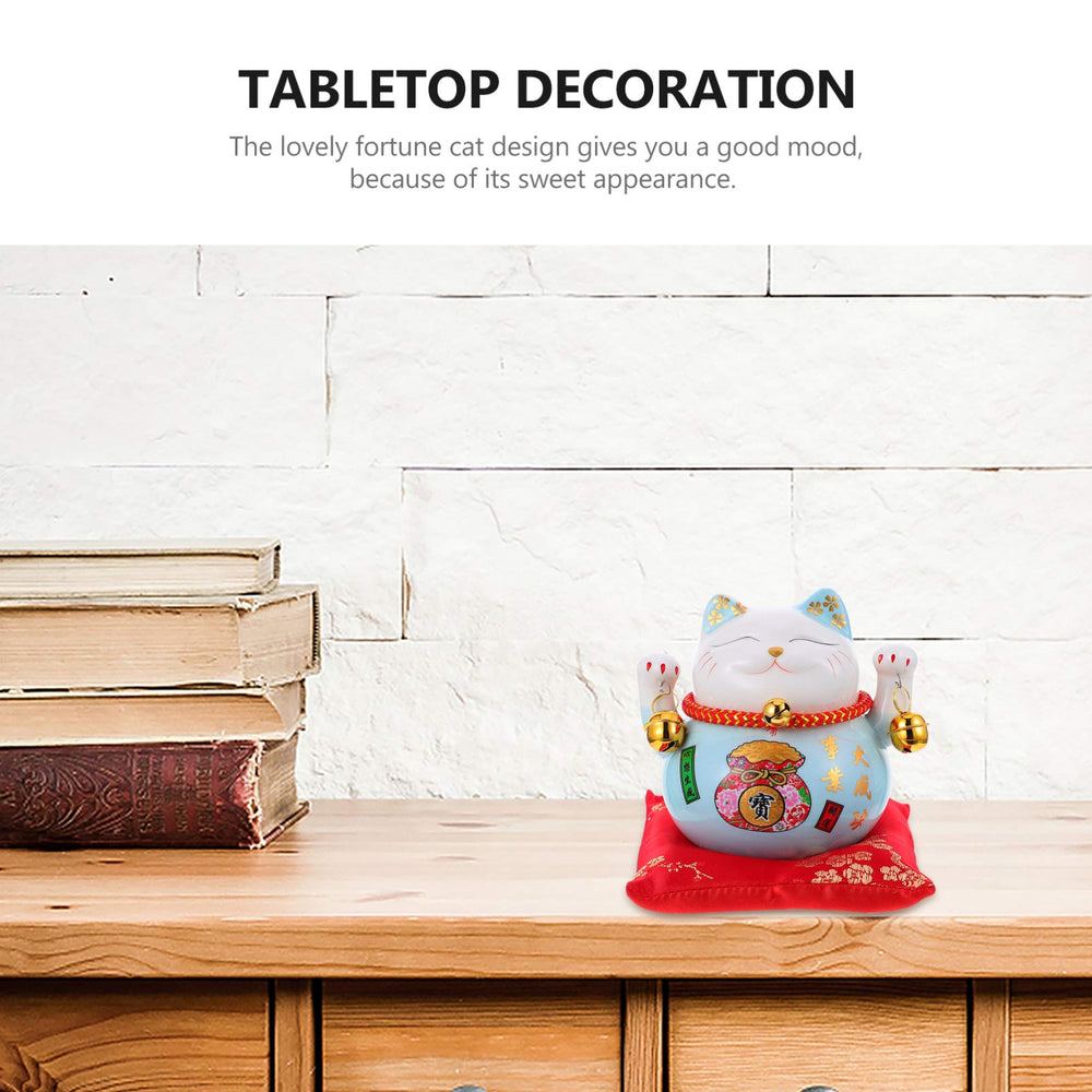 Garneck blue ceramic cat bank sits on a shelf in a cozy entryway.