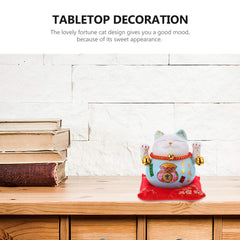 Garneck blue ceramic cat bank sits on a shelf in a cozy entryway.