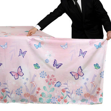 Gatherfun butterfly tablecloth brightens birthday scenes and pairs with purple décor.