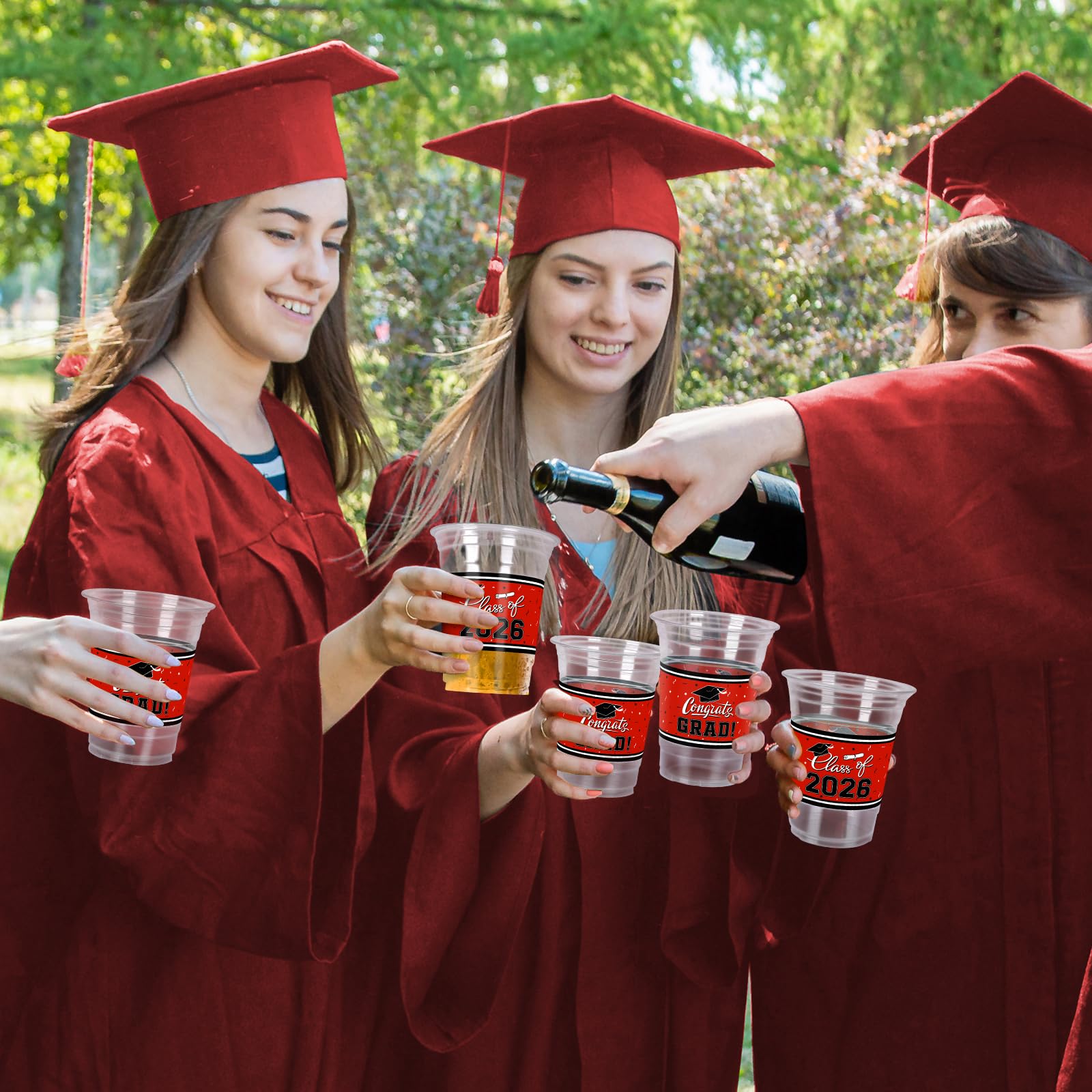 Gatherfun red graduation cups stand out on tables with slogans.
