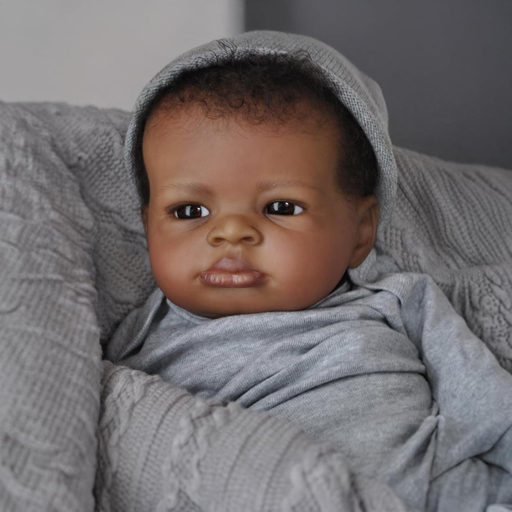 Generic realistic baby doll black boy with magnetic pacifier for safe quiet-time rituals.