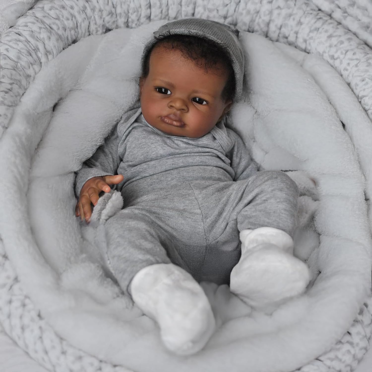 Generic realistic baby doll black boy with toy bottle enhances nurturing pretend feeding.