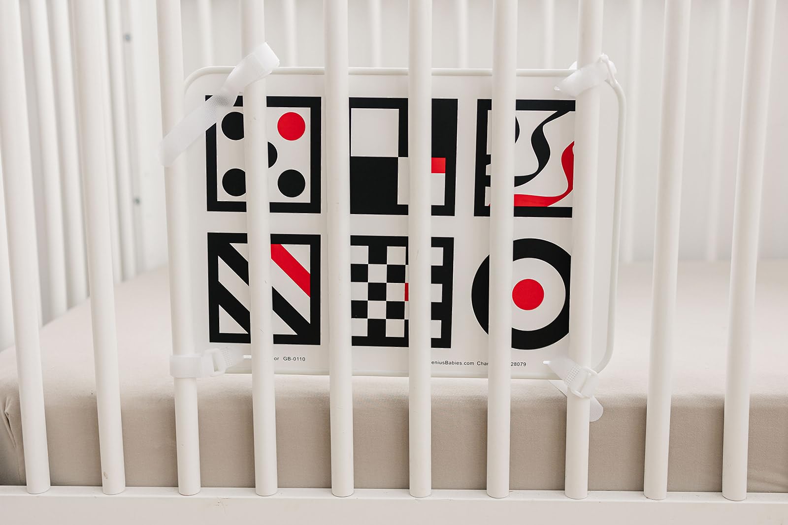 Genius Baby Toys crib attachment with velcro for secure mounting