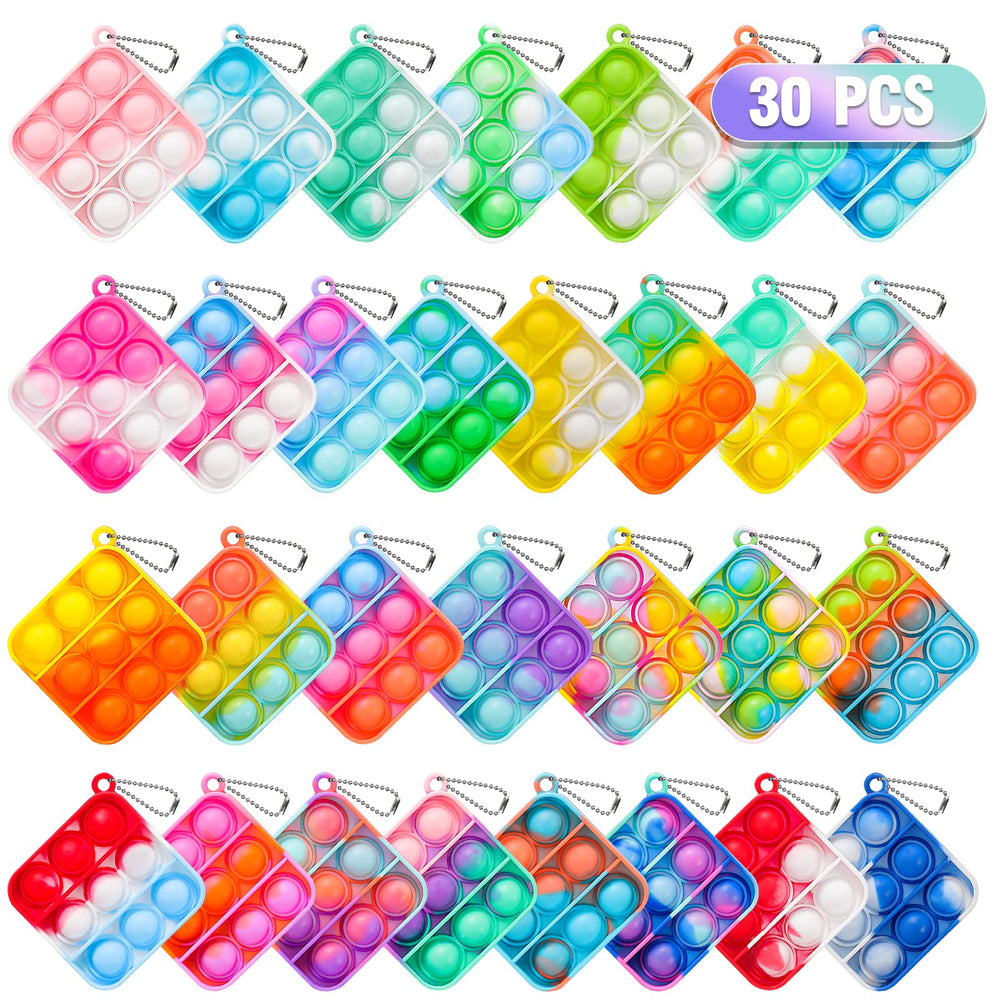Genuvi Pop fidget keychain in hand offering portable sensory fun for kids