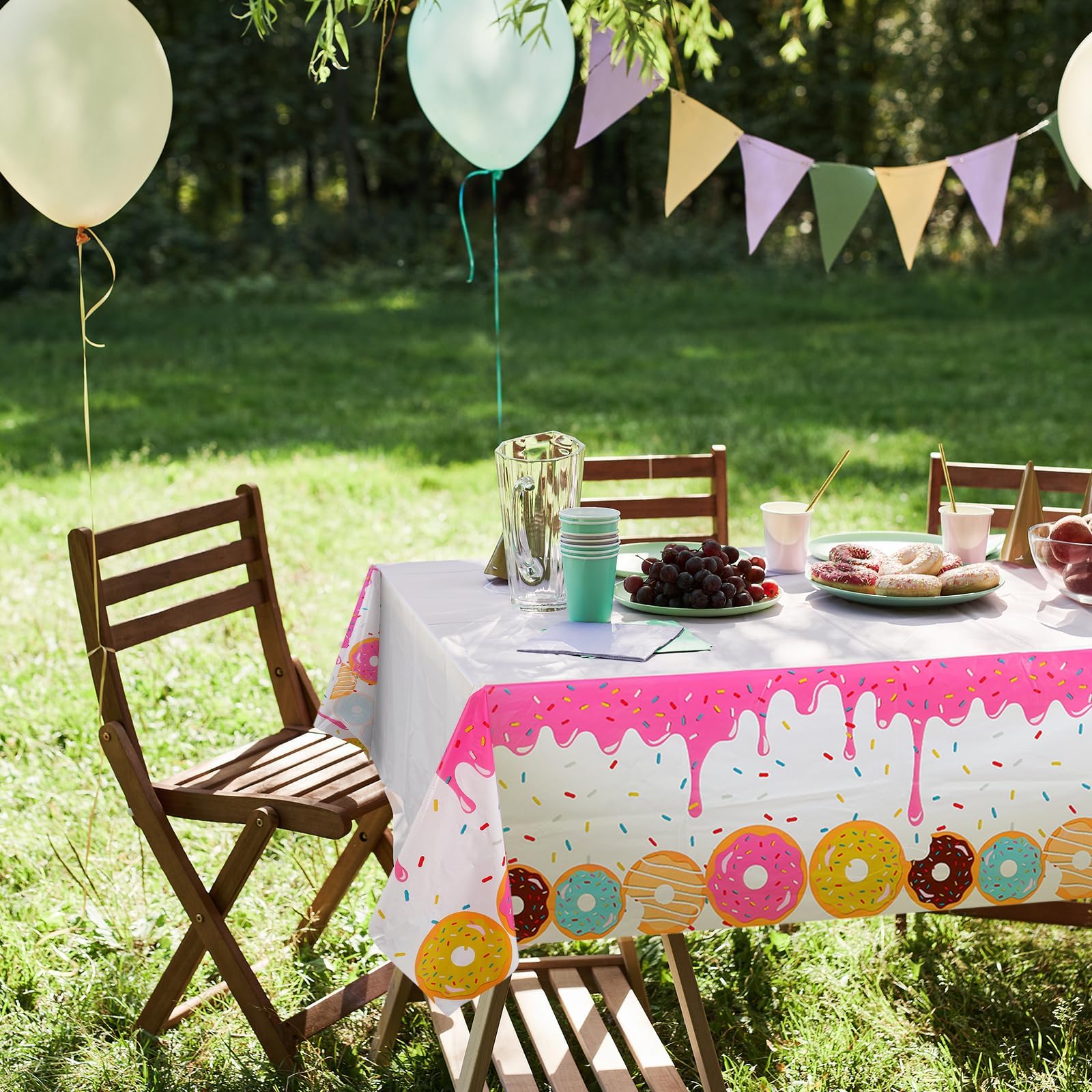 GGDE donut themed table cover used as a photo backdrop for birthday moments