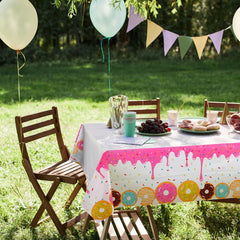 GGDE donut themed table cover used as a photo backdrop for birthday moments