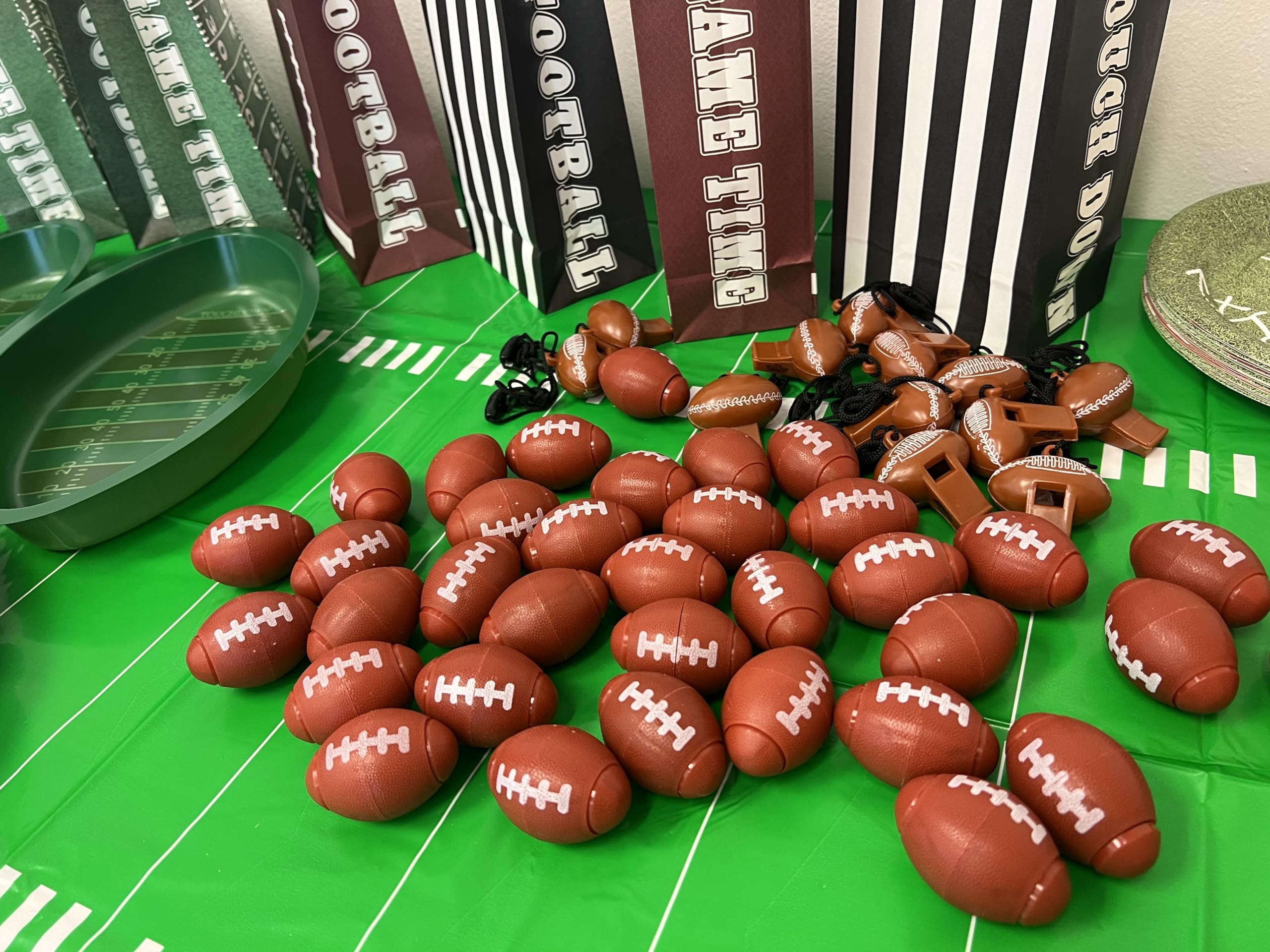 GiftExpress football-themed spinner showcased as party favors on a table.
