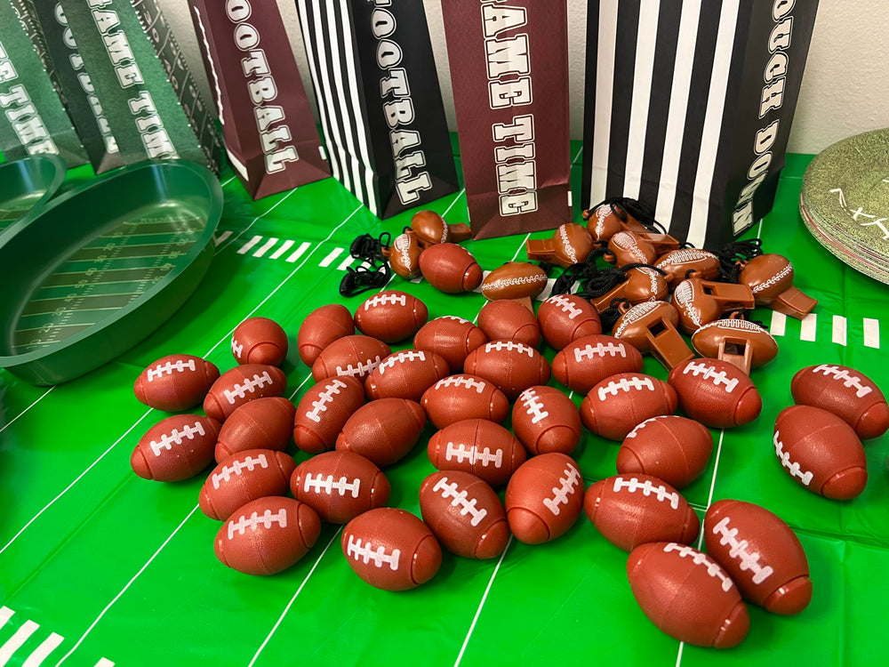 GiftExpress football-themed spinner showcased as party favors on a table.