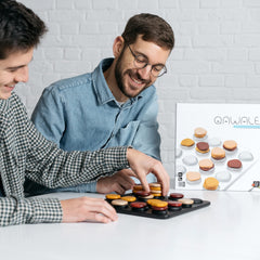 Gigamic Qawale Mensa Select award badge underscores award-winning abstract strategy.