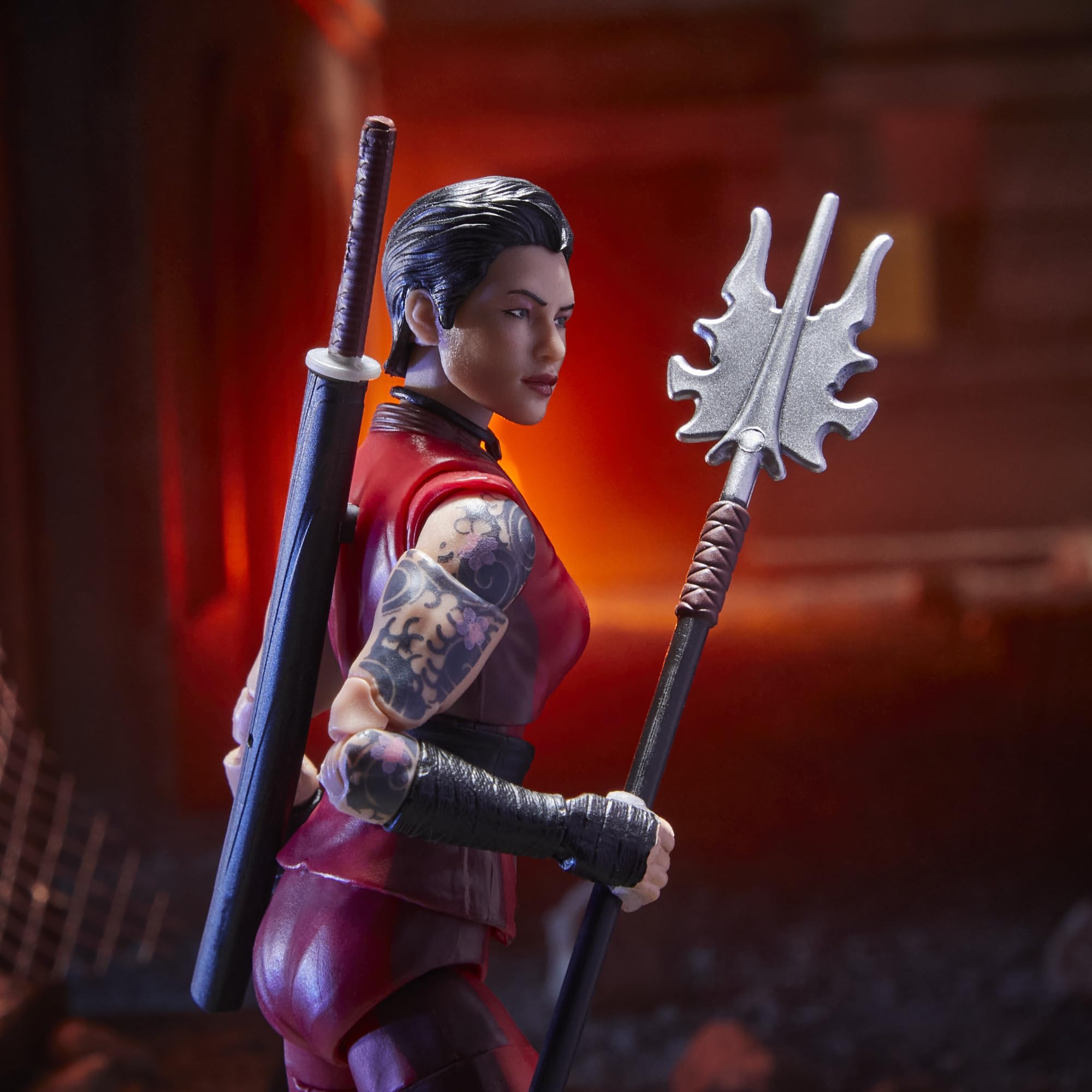 Windowed packaging highlights figure, accessories, and original artwork