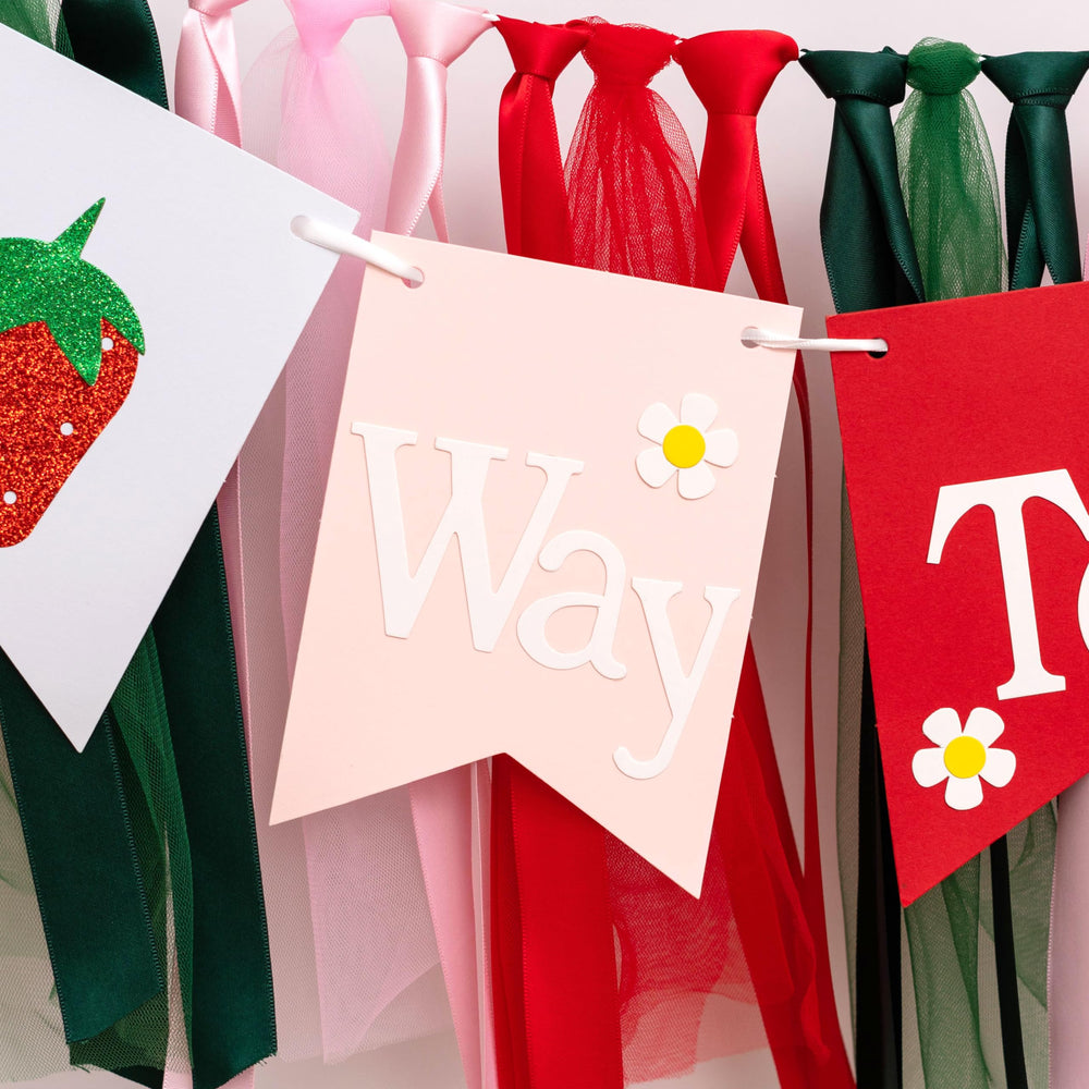 GIOGUK strawberry banner elevates high-chair decor at baby showers.