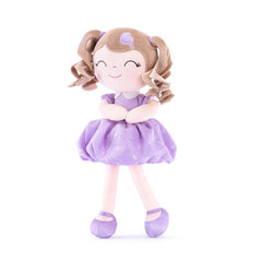Gloveleya baby doll with curly hair and purple dress; a soft cuddle for imaginative play.