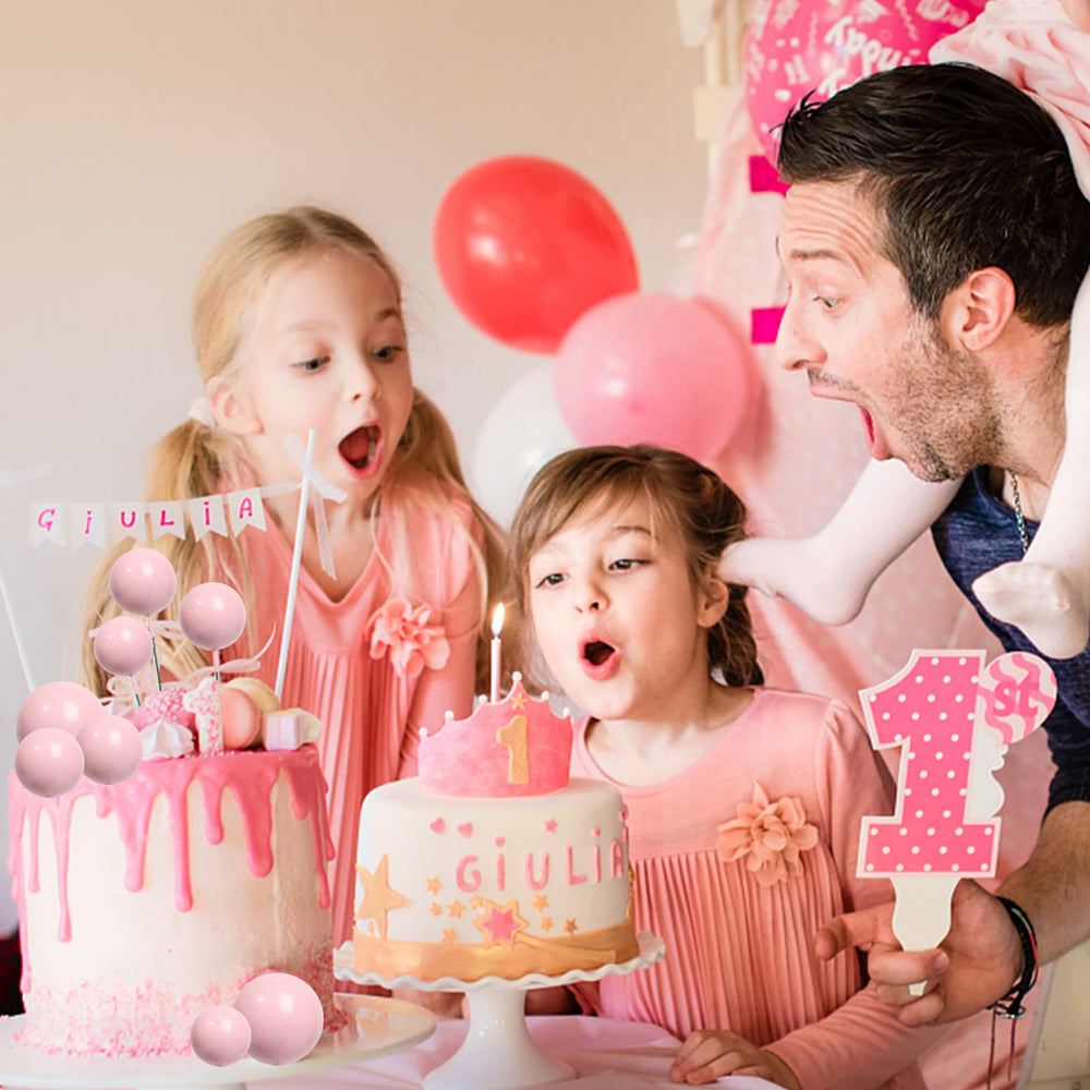Goensjt pink ball toppers cupcake display adds cheerful color.