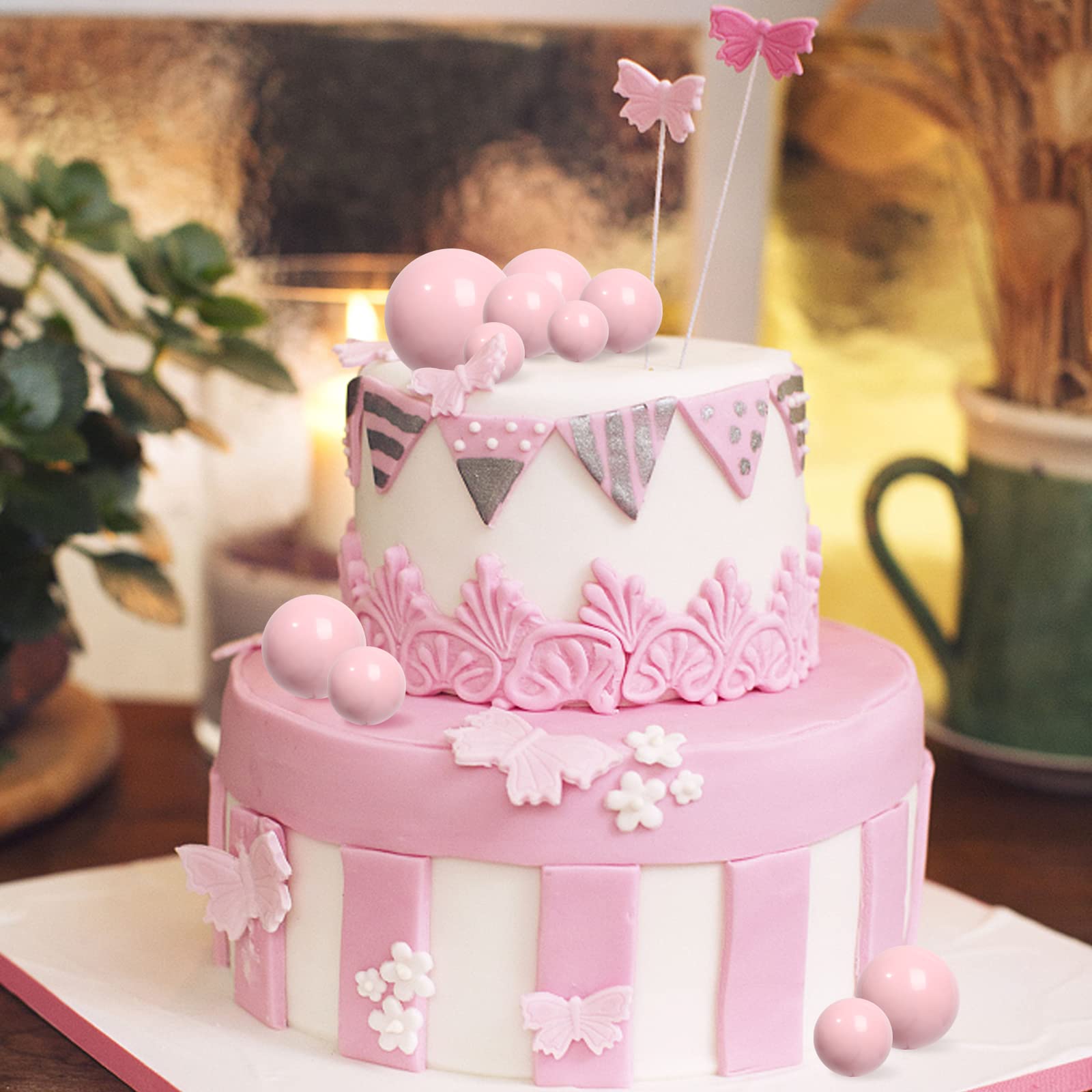 Goensjt pink ball topper wedding decor enhances table appeal.