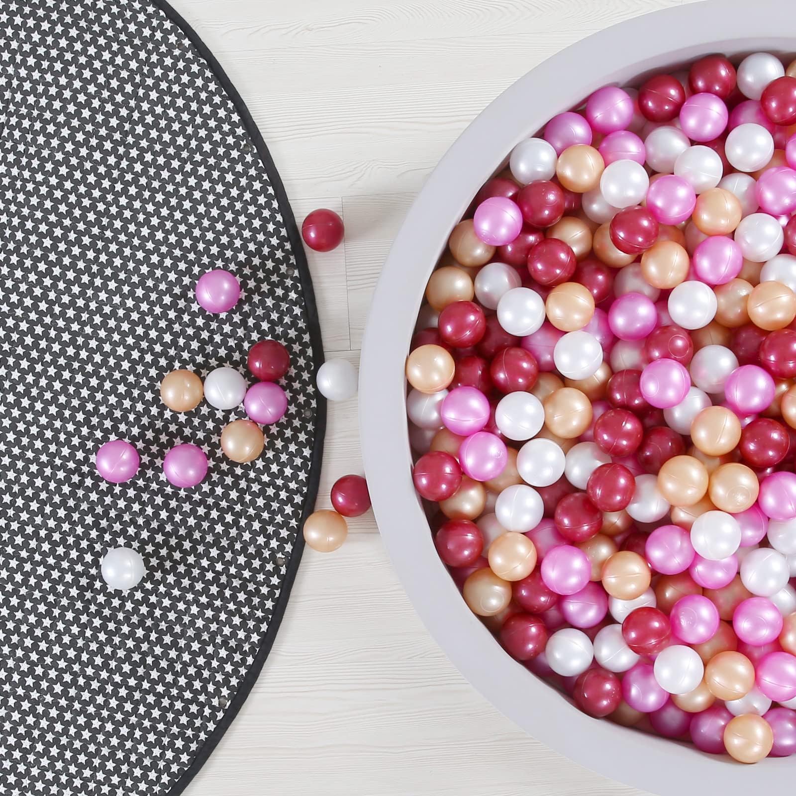 GOGOSO ball pit balls in dark pink, gold, white, and red for quick colorful pit setup.