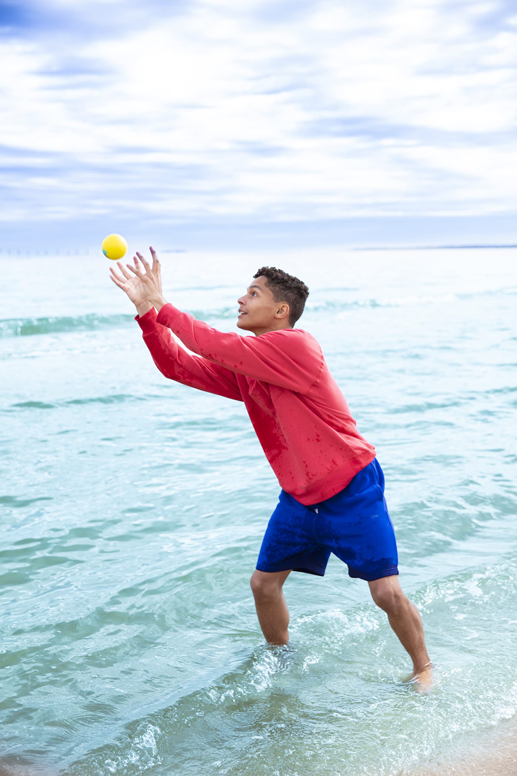 Goliath Wahu Water Bouncer teal lake or beach play by the water.