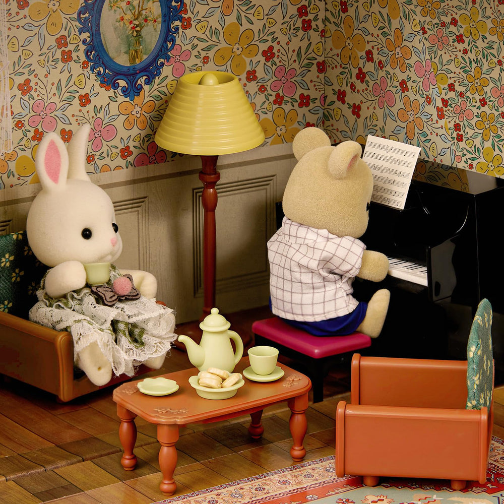Golray dollhouse suitcase floor lamp provides ambient storytelling lighting.