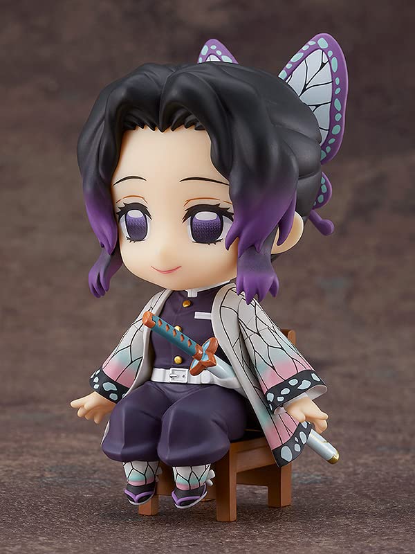 Good Smile Demon Slayer Shinobu Kocho Swacchao chair-edge display on a compact desk.