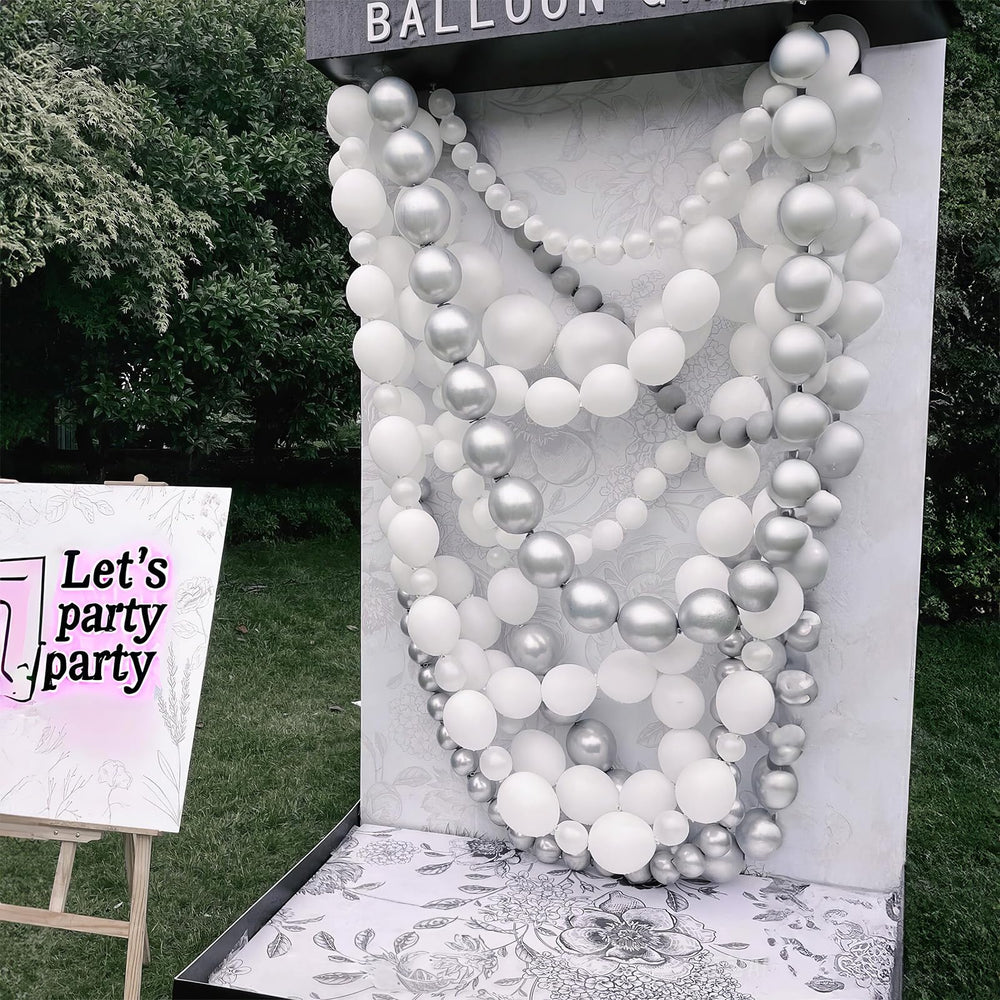 Close-up of Govpy pearl-white balloons showing shine.
