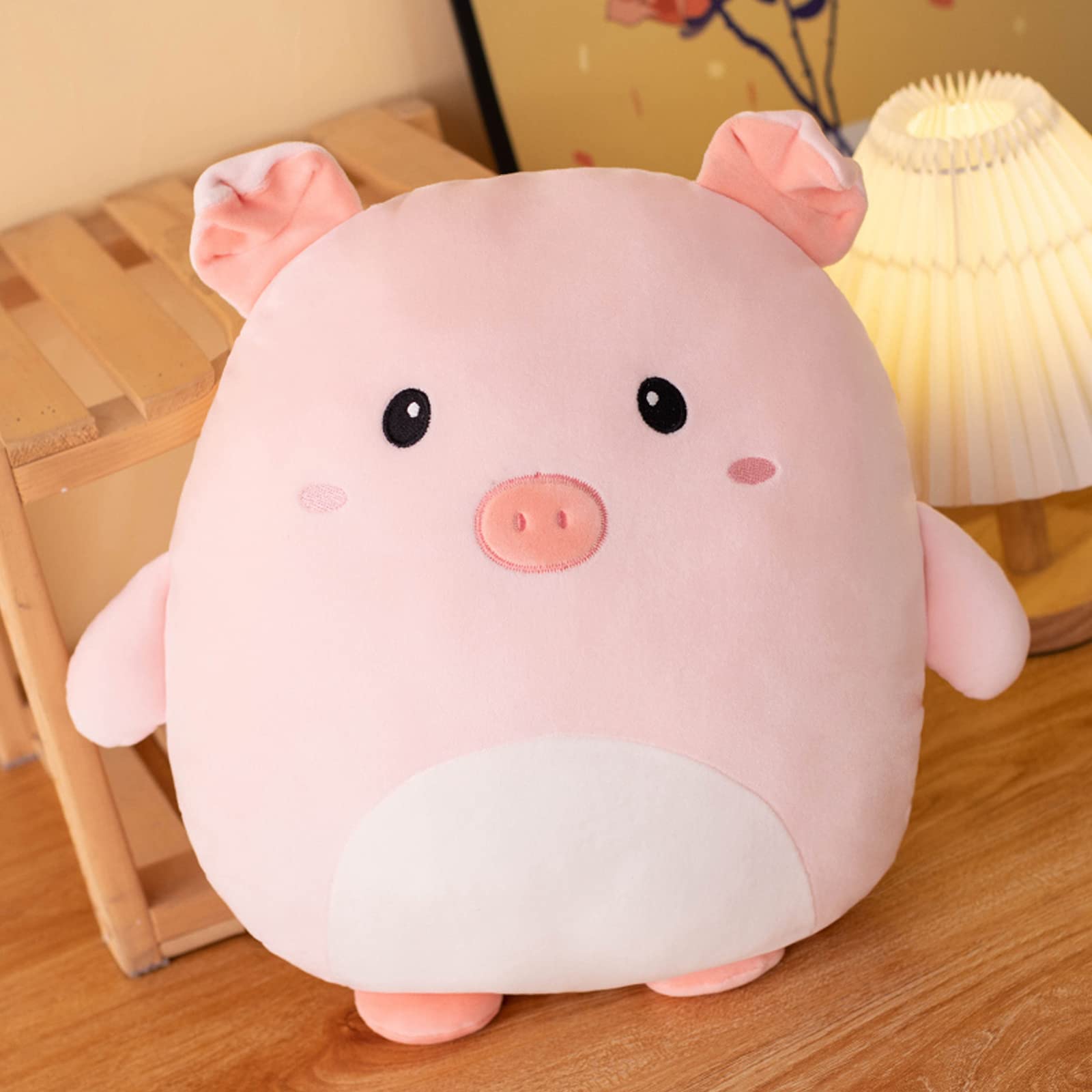 Grafingy Pig plush on bed adds playful decor as a throw pillow.