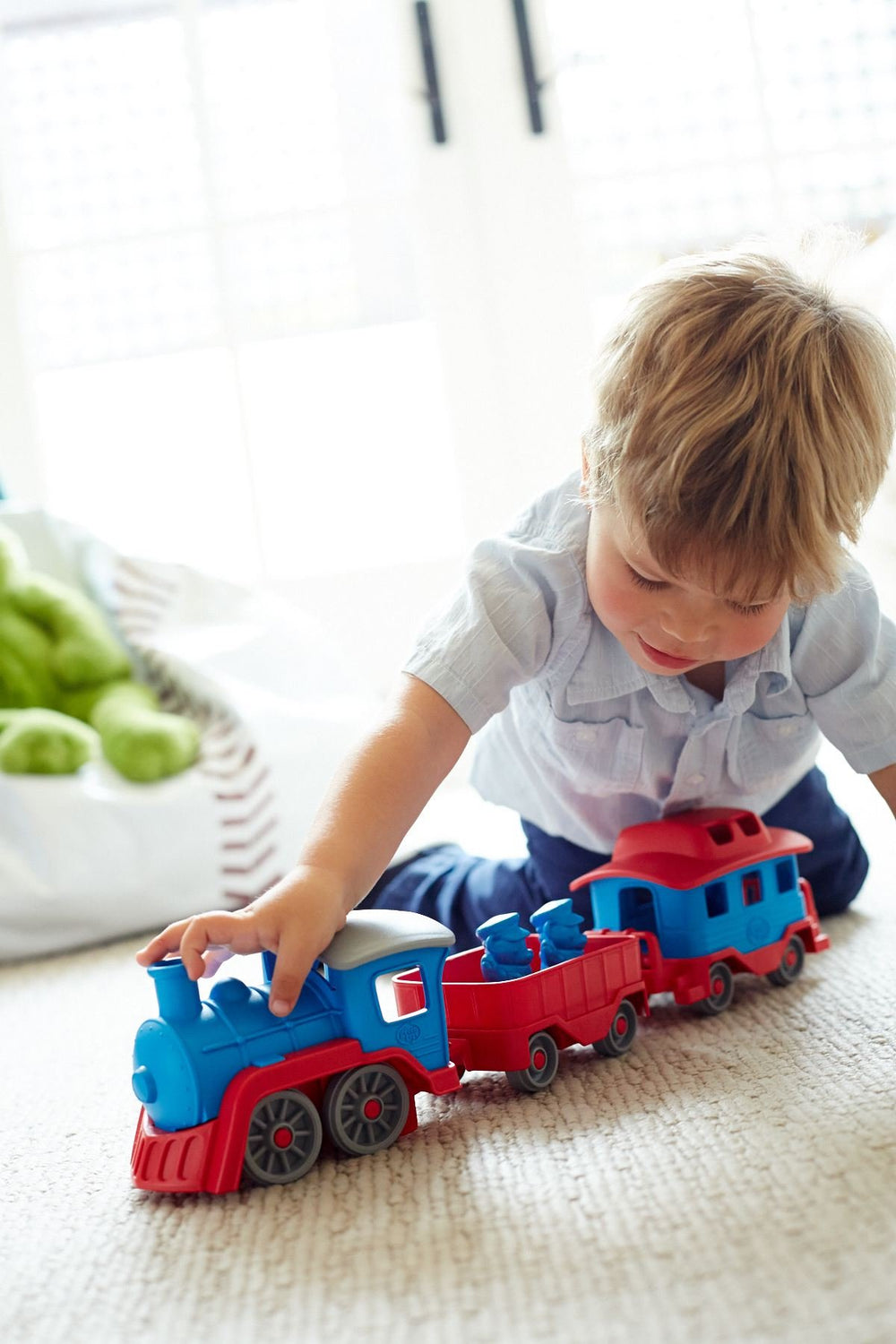 Green Toys Train Blue kids holding it for hands-on play