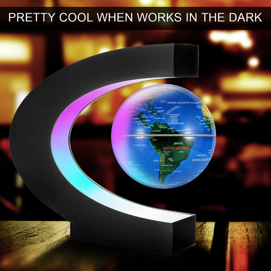 Gresus C-shaped LED frame surrounding the levitating globe for ambient desk lighting.