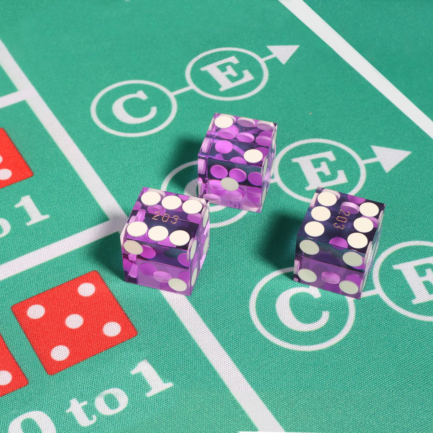 GSE purple casino dice close-up highlights the polished finish and razor edges.
