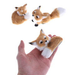 GUDVES squatting fox figurine adds whimsical charm to shelves and tabletops.