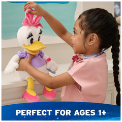 Bright pink velour bow on Daisy Duck adds Disney flair