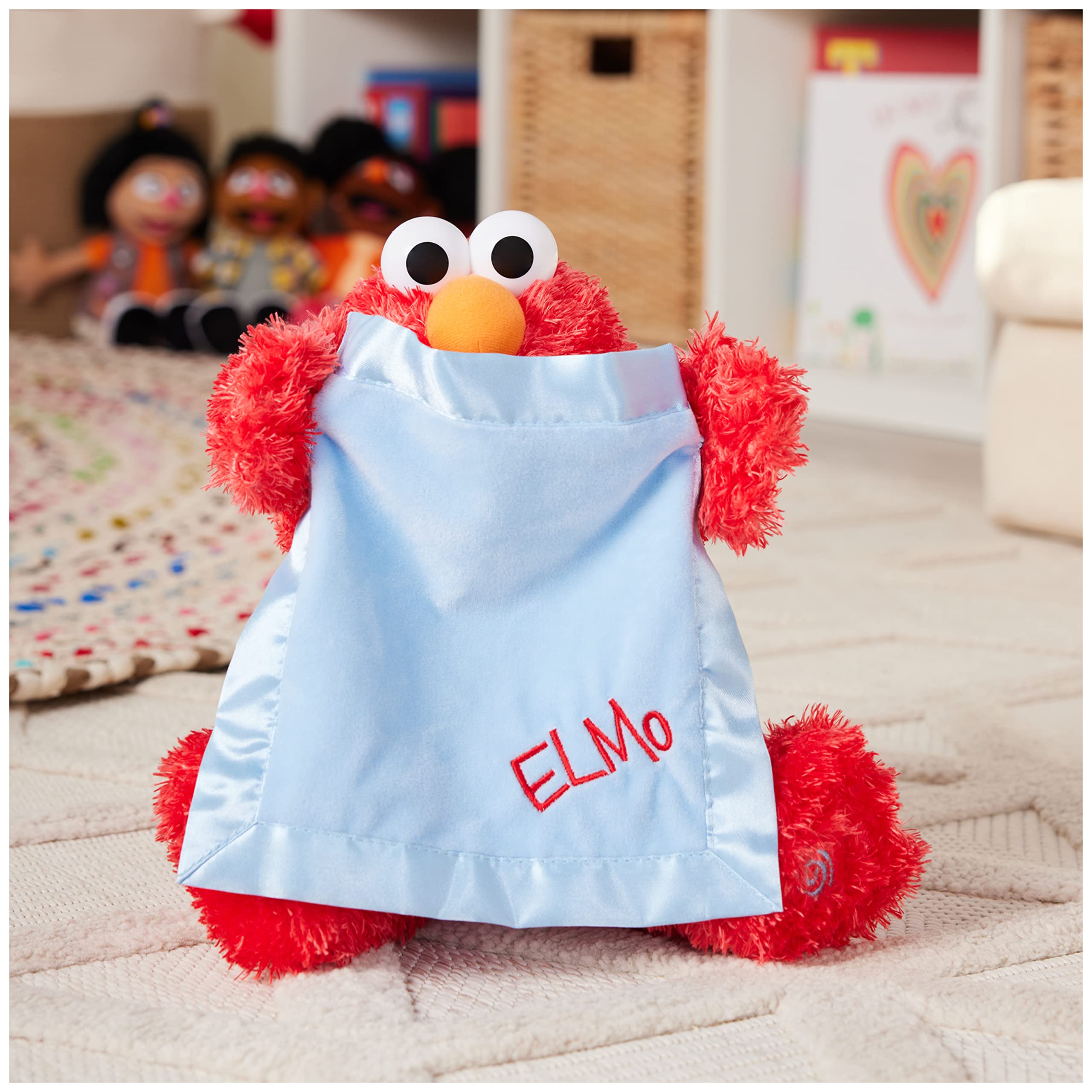 Elmo's expressive eyes and bright smile invite cuddles and interaction.